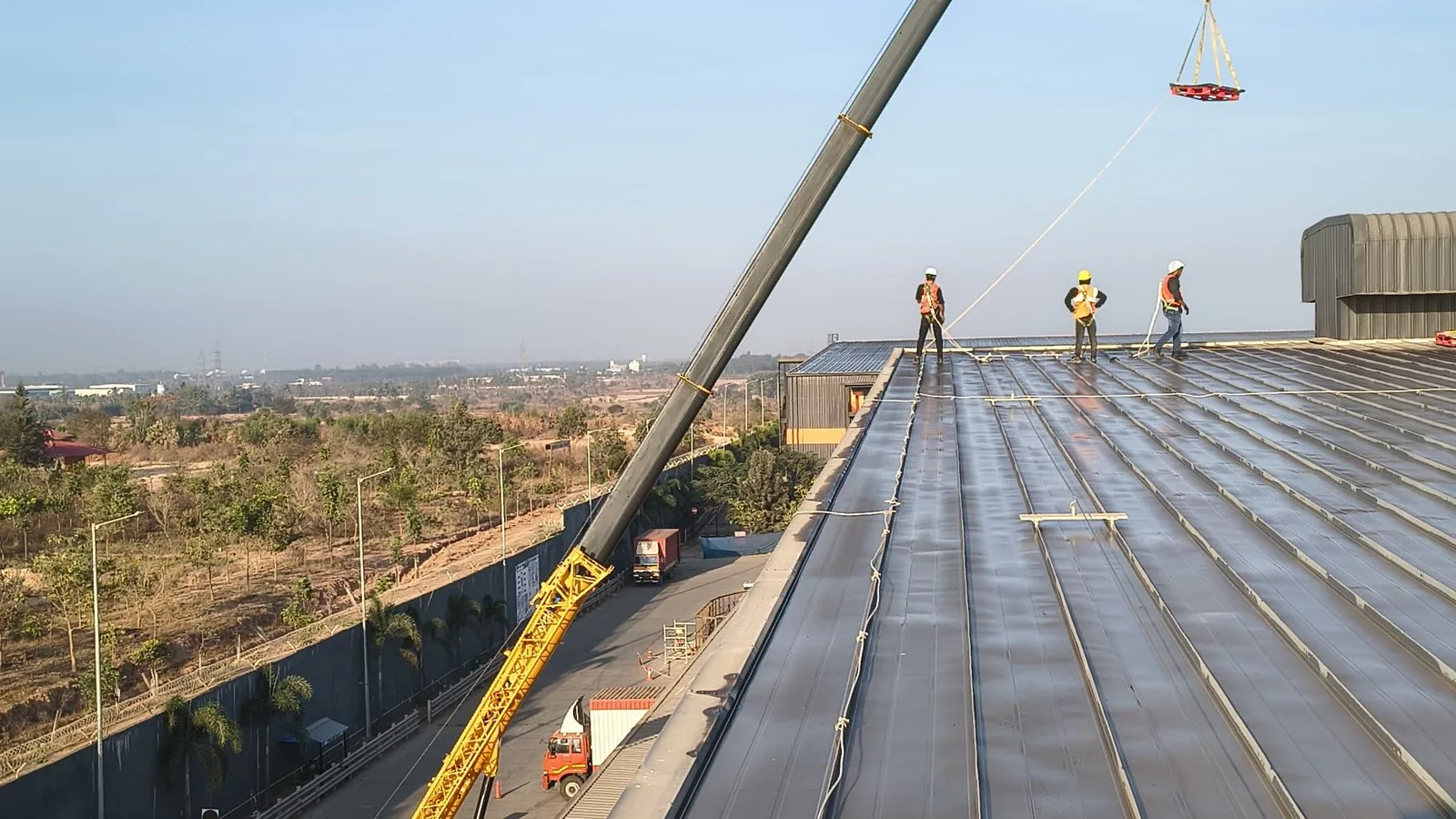 60-ton mobile crane executing ridge closing on a world-class facility